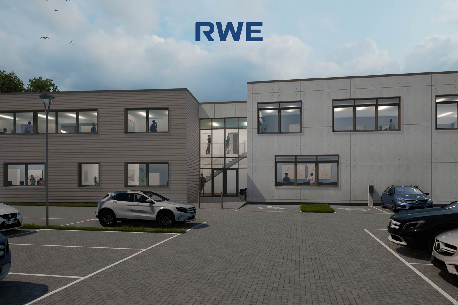 Zwei moderne Bürogebäude mit Fenstern, Parkplatz und Mitarbeitern, die im Inneren sichtbar sind.